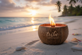 coconut shell burning wooden wick candle with tribe wellness engraved on shell on a romantic Caribbean beach